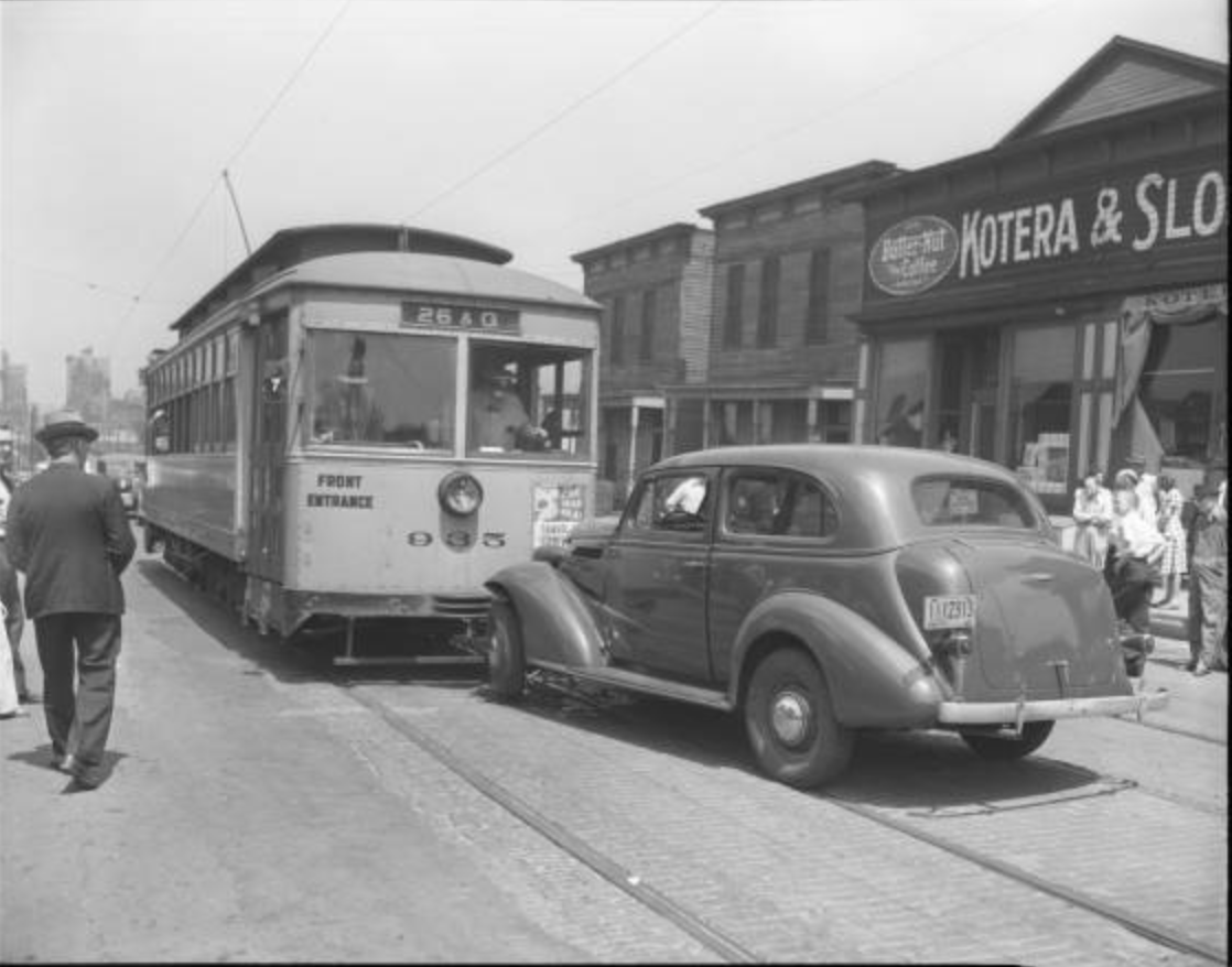 Vintage image of a car and street car near Kotera & Sloup